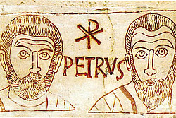 Die Gesichter von Petrus und Paulus als Gravur in einer römischen Katakombe. 